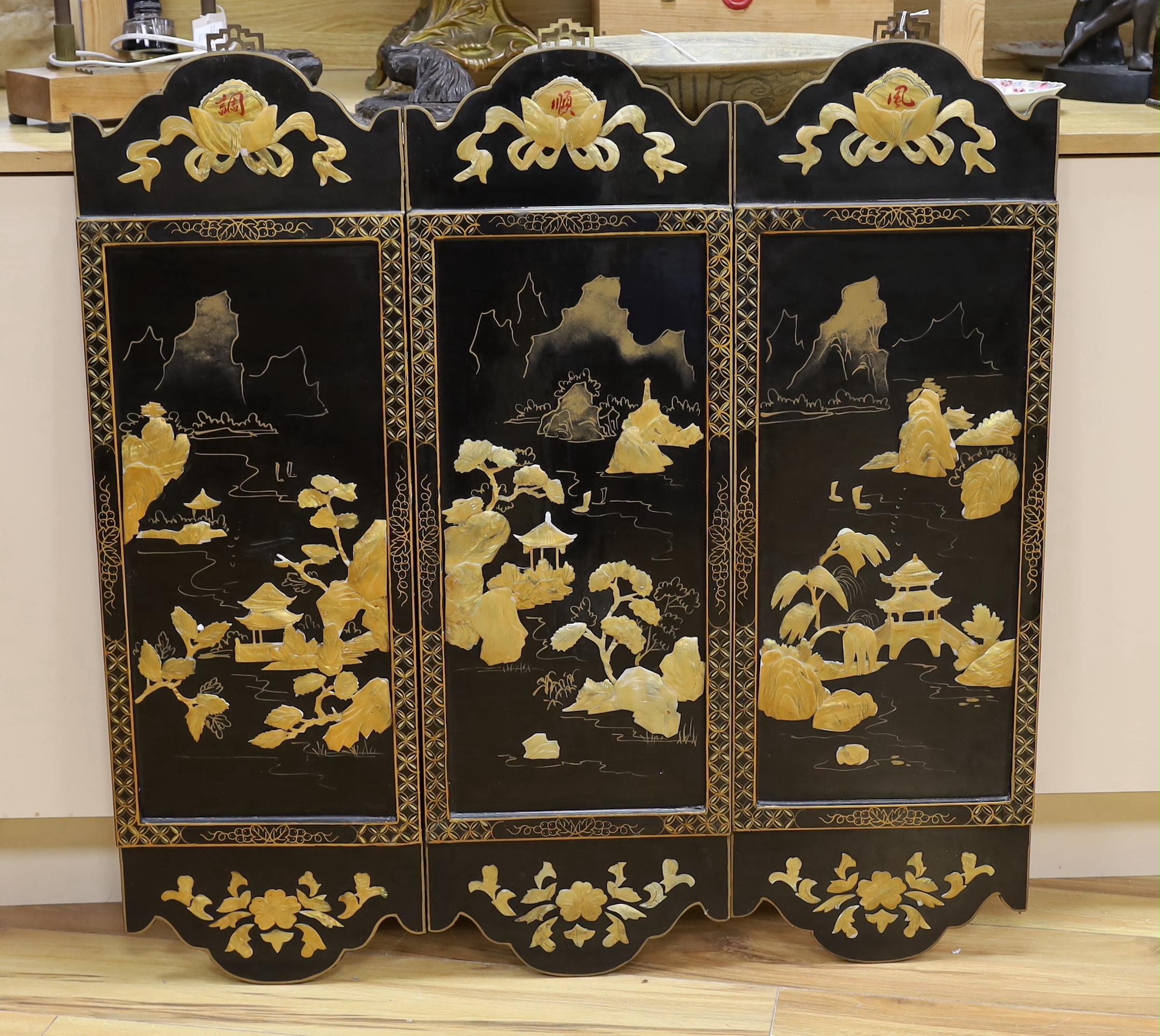 Three Chinese black lacquered, mother of pearl inset and gilt decorated panels, 94cm high